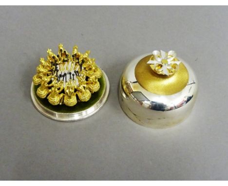 A Stuart Devlin Christmas box, containing a silver gilt and enamelled model representing the twelfth day of Christmas, being 