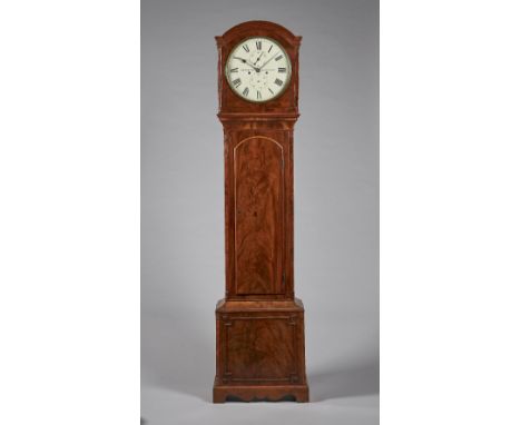 A late Regency mahogany longcase clockBy Newsome, TottenhamThe case with a shallow arch above a brass bezel and convex glass,