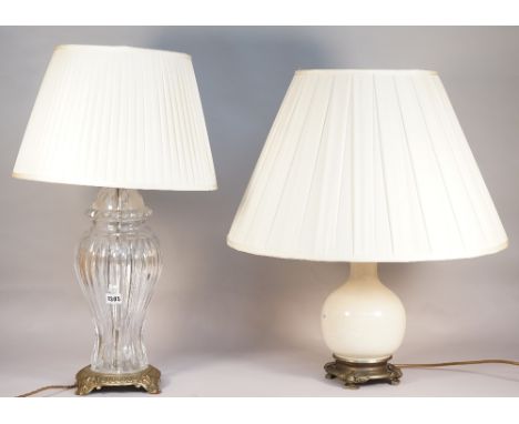 A modern glass and gilt metal table lamp of fluted baluster form and a Chinese style pottery table lamp, both with pleated cr