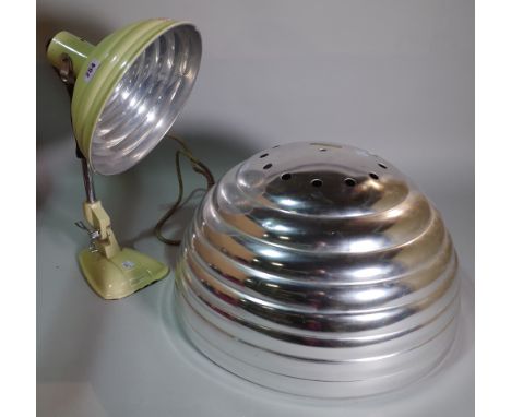 A 20th century cream painted heat lamp converted to a table lamp and a ribbed metal ceiling light shade, (2). 