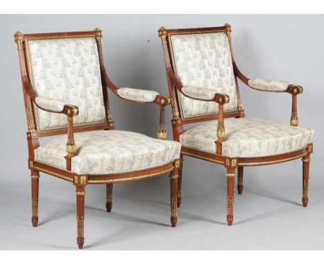 A pair of Louis XVI style gilt metal mounted square back open armchairs with bow seat on tapering fluted supports, 65cm wide 