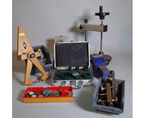 Horological interest; a quantity of watchmaker's tools, mainly clamps, brackets and sundry, (qty). 