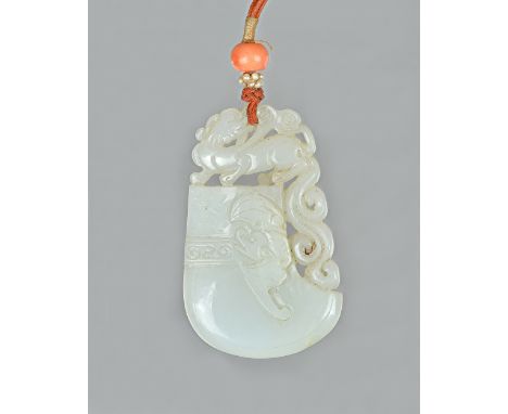 A Chinese white jade pendant, Qing dynasty, in the form of an archaistic axe, carved on the front with a bat and surmounted b