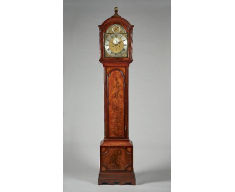 A George III mahogany longcase clockBy Thomas Batters, LondonThe well-figured case with an arched pediment, surmounted by a f