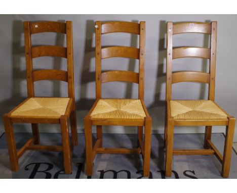 A set of six 20th century oak ladder back dining chairs, 45cm wide x 105cm high, (6). 