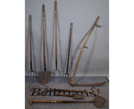 A quantity of 19th century and later farming tools, spades, pitchforks and sundry, (qty). 