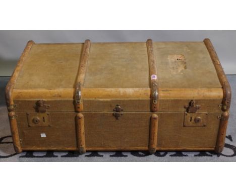 An early 20th century canvas and wood band travelling trunk, 126cm wide. 
