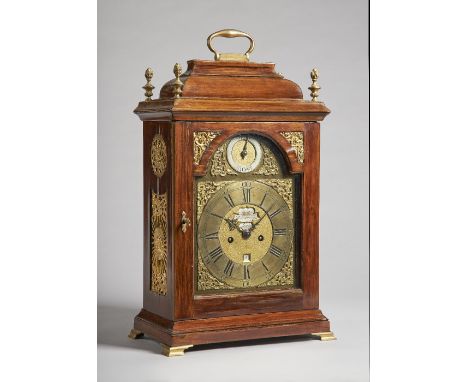 A giltmetal-mounted fruitwood bracket clockThe movement by Joseph Windmills, LondonThe bell-top case with a brass carrying ha