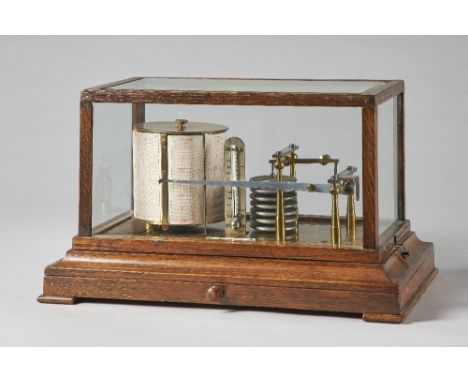 An Edwardian oak cased barograph Signed Turnbull & Co., EdinburghWith bevelled glass panel to the top, the brass frame with a