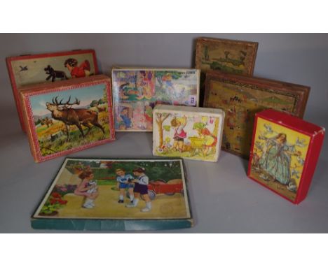 Toys comprising; a quantity of mid-20th century vintage puzzles and building blocks, (qty). 