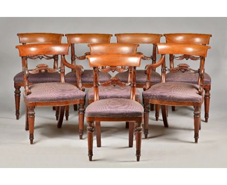 A set of eight William IV mahogany dining chairs with concave crest rail, acanthus waist and bow seat on tapering turned supp