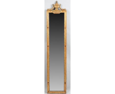 A 19th century gilt framed pier mirror with urn crest over moulded frame, 33cm wide x 157cm high. 