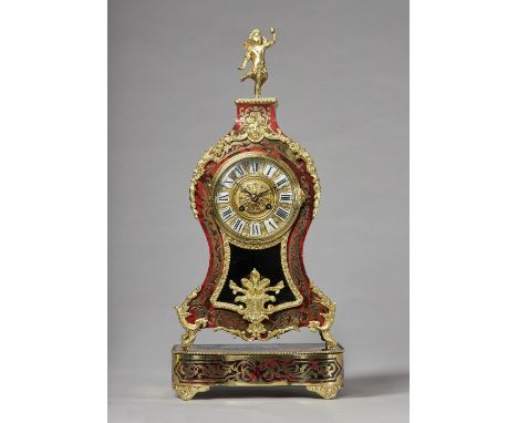 A French giltmetal-mounted tortoiseshell and cut brass-inlaid mantel clockIn the Louis XV style, circa 1870Surmounted by a wi