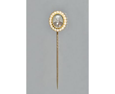 A Victorian gold and half pearl set presentation stick pin, mounted to the centre with an oval photographic portrait of John 