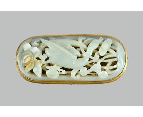 A Chinese celadon jade plaque, probably 17th/18th century, set with a gilt-metal mount, carved and pierced with a bird amongs