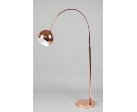 A 1970s style adjustable copper coloured floor light, a matching table lamp with shade and a 1960s style wall clock, (3). 