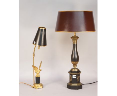 A Regency style ebonised wooden table lamp with gilt metal mounts on an octagonal base, with shade, 68cm high overall and an 