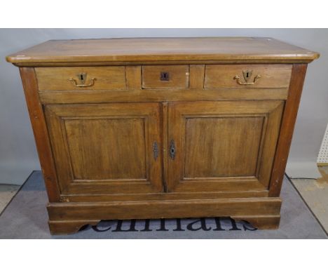 An early 20th century French Beech commode with three frieze drawers over cupboard base on bracket feet, 142cm wide x 104cm h