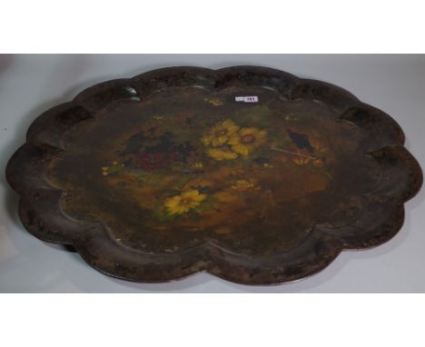 A Victorian tôle peinte tray foliate decorated with scalloped rim, 77cm wide, a Victorian oval papier mâché tray, a rectangul