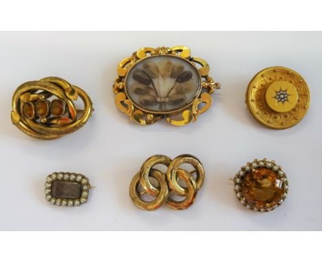 A gold brooch, claw set with a circular cut citrine to the centre, in a surround of cultured pearls, a small Georgian brooch,