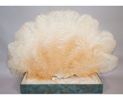 J. Duvelleroy, a French ostrich feather fan of large proportions, early 20th century, with mother-of-pearl sticks and origina