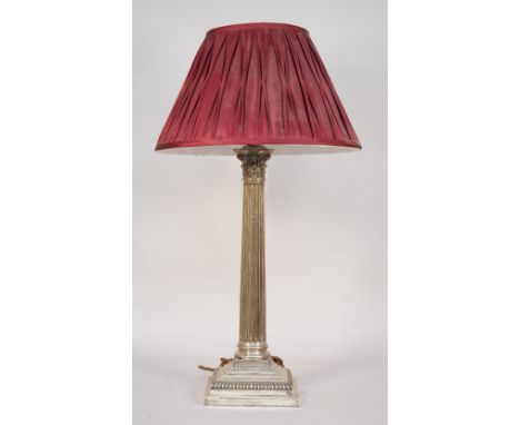 A silver table lamp, hallmarked Goldsmiths and Silversmiths, London 1901, of Corinthian column form on a stepped square base,