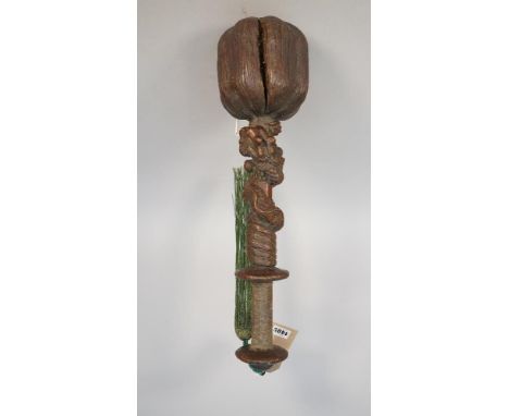 Tribal interest; an unusual South East Asian hardwood club, the bulbous head of naturalistic form, the octagonal shaft carved