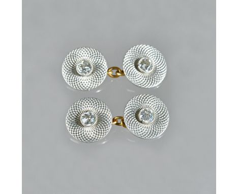 A pair of platinum and gold, diamond set dress cufflinks, with circular backs and fronts, each side collet set, with a cushio