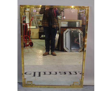 A 20th century brass framed wall mirror 108cm x 82cm. 