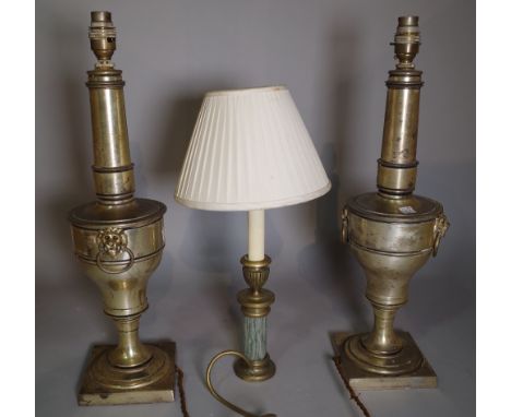 A pair of 20th century silvered metal table lamps with lion mask handles, 51cm high and another smaller 20th century lamp, 38