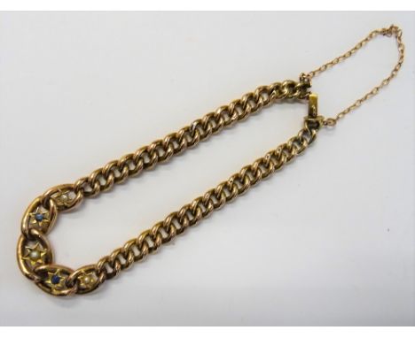 A gold, sapphire and half pearl set bracelet, in a hollow curb link design, on a snap clasp, detailed 9 CT, circa 1910, fitte