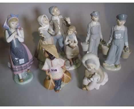 Ceramics, Lladro, a group of six figures including bisque glazed figures, carol singers, etc. 
