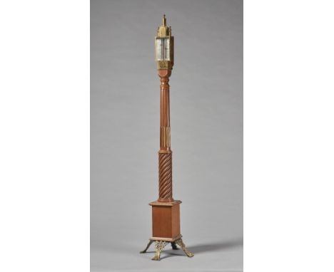 A giltmetal-mounted walnut portable standing barometerAfter the model by Daniel QuareThe top with gilt glazed hood and silver