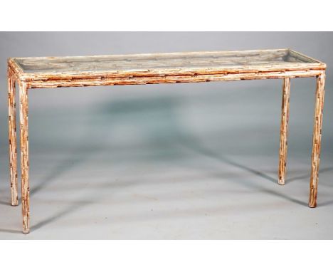 A 20th century console, the rectangular glass inset top on a limed naturalistic carved wood base, 151cm wide x 75cm high. 