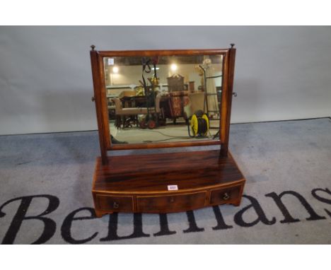 A 19th century mahogany bowfront toilet mirror with three frieze drawers, 52cm wide x 53cm high. 