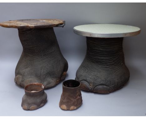 Taxidermy; three elephant feet, early 20th century, each mounted as a low seat, 44cm high and two baby elephant feet, unmount