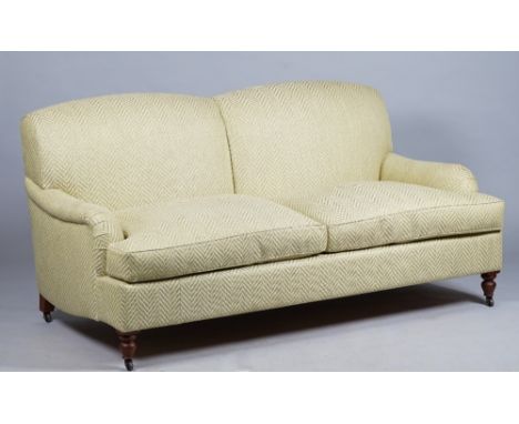 Kingcome Sofas; a modern green upholstered double hump back sofa on turned supports, 187cm wide x 90cm high. 