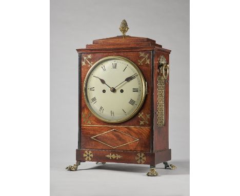 A Regency gilt brass-mounted mahogany and cut brass-inlaid bracket clockThe chamfer top with pineapple finial above a stepped
