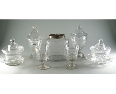 A group of glassware, 19th century, comprising; an oval facet cut tea caddy with silver plated hinged cover, 17cm. high; two 