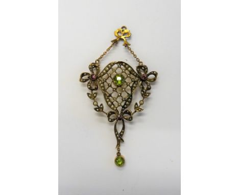 A gold, peridot, seed pearl and gem set pendant, in a lattice pierced wreath and bow design, collet set with the circular cut