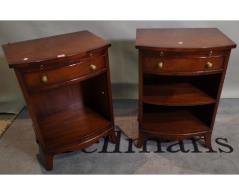 A pair of Regency style mahogany bedside cupboards with single drawer on splayed bracket feet, 51cm wide x 69cm high, (2). 