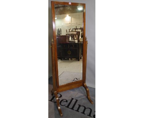 An Edwardian mahogany and inlaid cheval mirror on outswept supports, 51cm wide x 159cm high and a pair of Edwardian hall chai