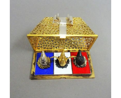 A Stuart Devlin Christmas box, containing a silver gilt and enamelled model representing the third day of Christmas, being Th