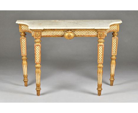 An early 19th century Italian console, the marble top with swept sides, the parcel gilt base with blind lattice frieze centre