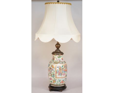 A Cantonese porcelain vase table lamp, late 19th century, with metal mounts, on a circular wooden base, with shade, the vase 