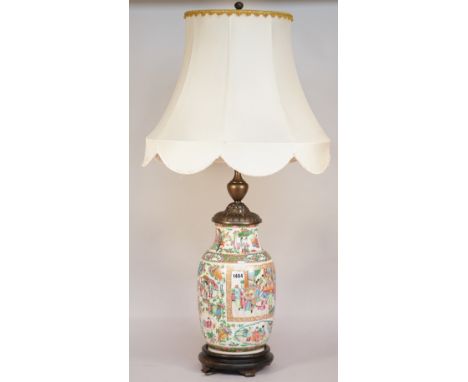 A Cantonese porcelain vase table lamp, late 19th century, with metal mounts, on a circular wooden base, with shade, the vase 