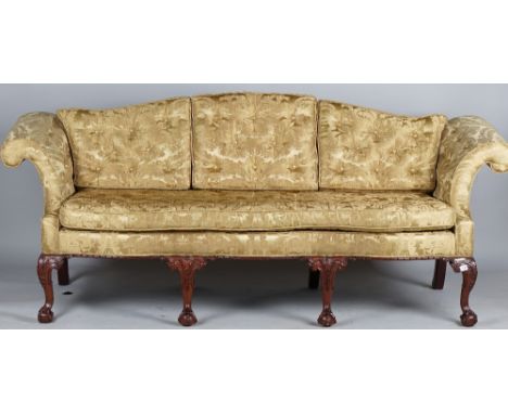 A George II style sofa with hump back, roll over arms and serpentine seat on four claw and ball feet, 220cm wide x 90cm high.