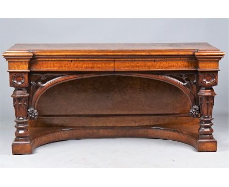 A Victorian Gothic pollard oak console, the inverted breakfront top with a pair of frieze drawers on carved octagonal support