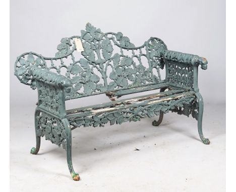 After Coalbrookdale; an oak and ivy pattern green painted cast iron garden bench, 150cm wide x 99cm high. 