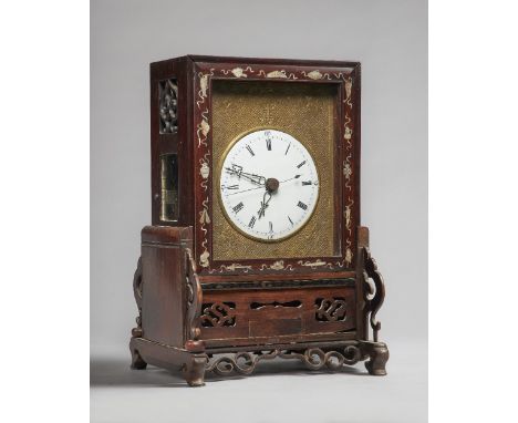 A Chinese hardwood and mother-of-pearl inlaid table clock19th centuryThe case with a glazed lift-up front cover and pierced b